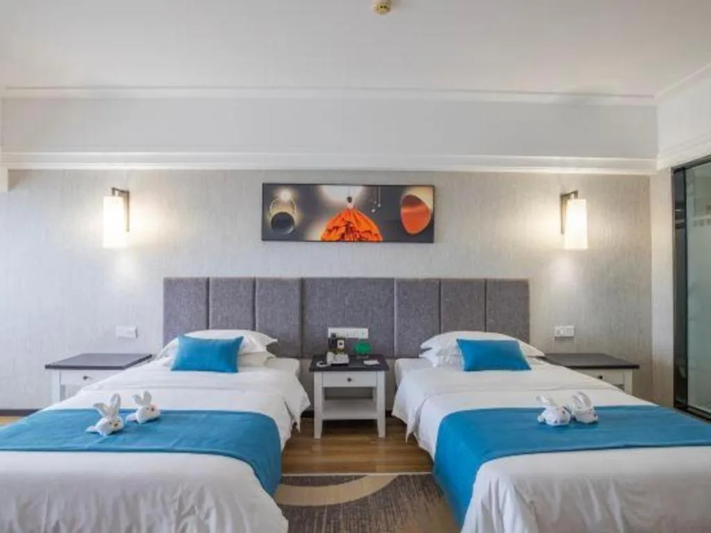 Bed in Ramada Encore by Wyndham Qionghai Downtown