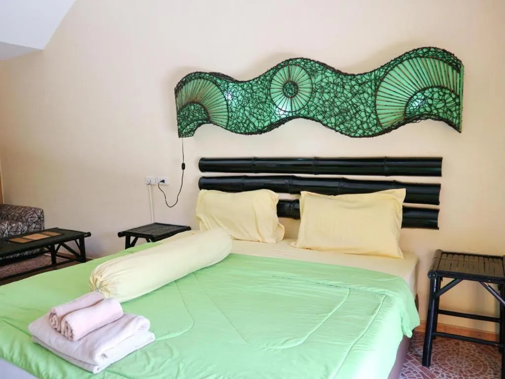 Bed in Kamala Tropical Garden Hotel