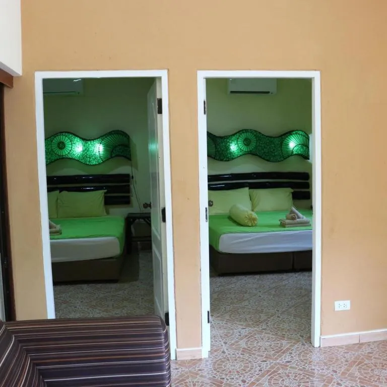 Bed in Kamala Tropical Garden Hotel