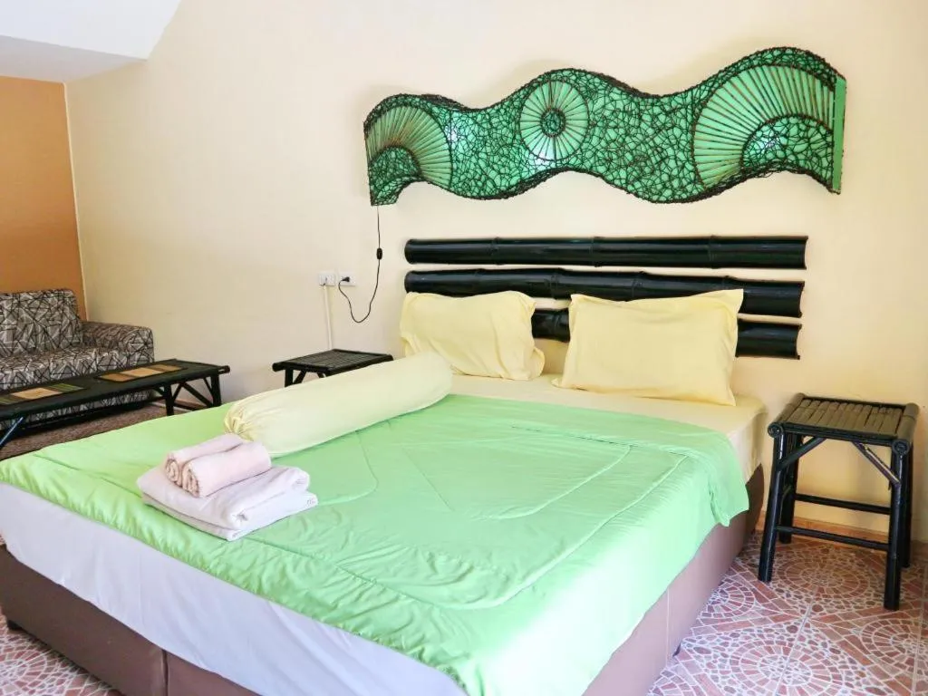 Bed in Kamala Tropical Garden Hotel