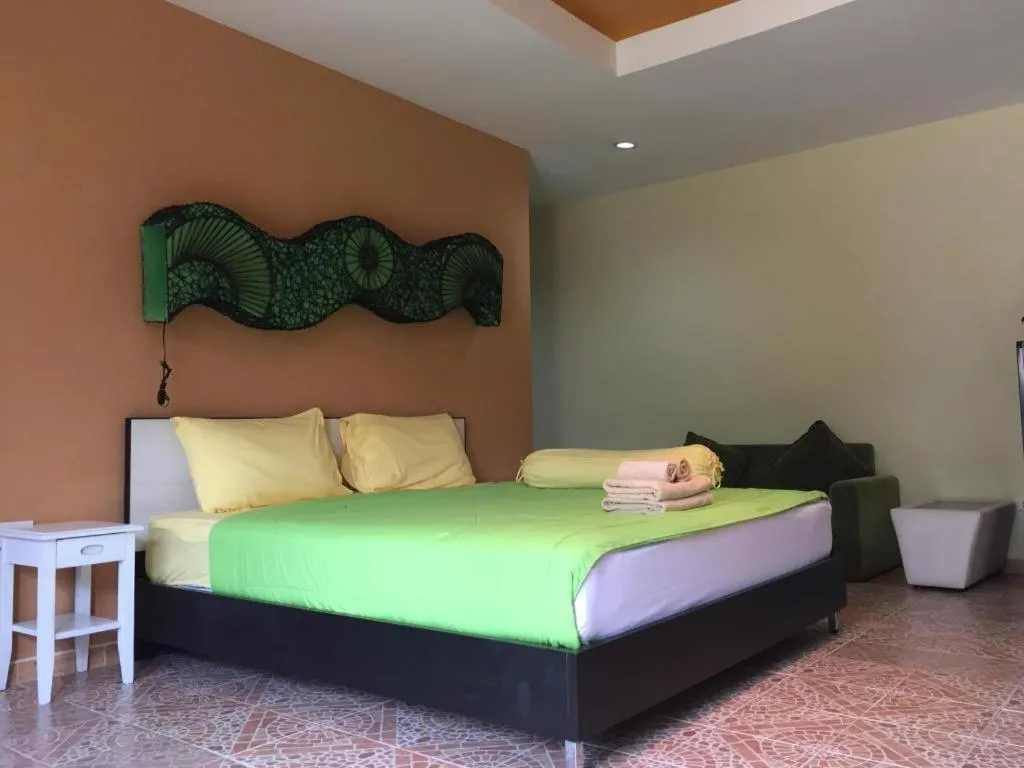 Bed in Kamala Tropical Garden Hotel