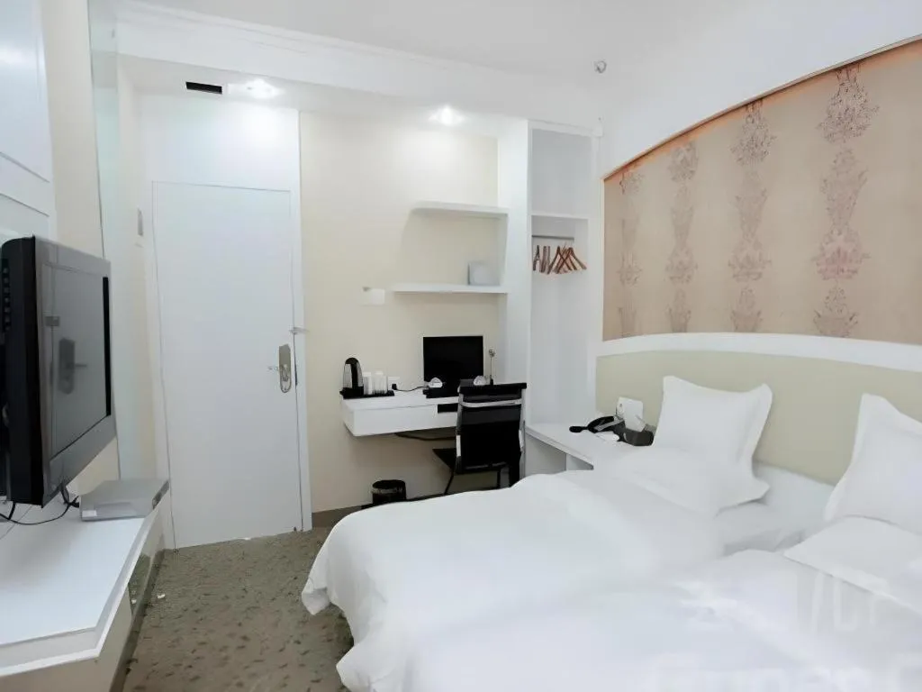 Bed in Xinghe Xinfeng Hotel Railway Station & Bus Station Branch