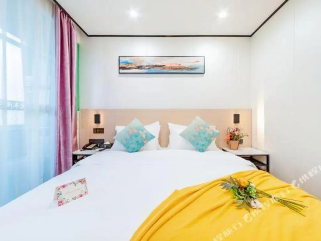 Bed in Xinghe Xinfeng Hotel Railway Station & Bus Station Branch