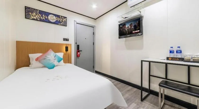 Bed in Xinghe Xinfeng Hotel Railway Station & Bus Station Branch