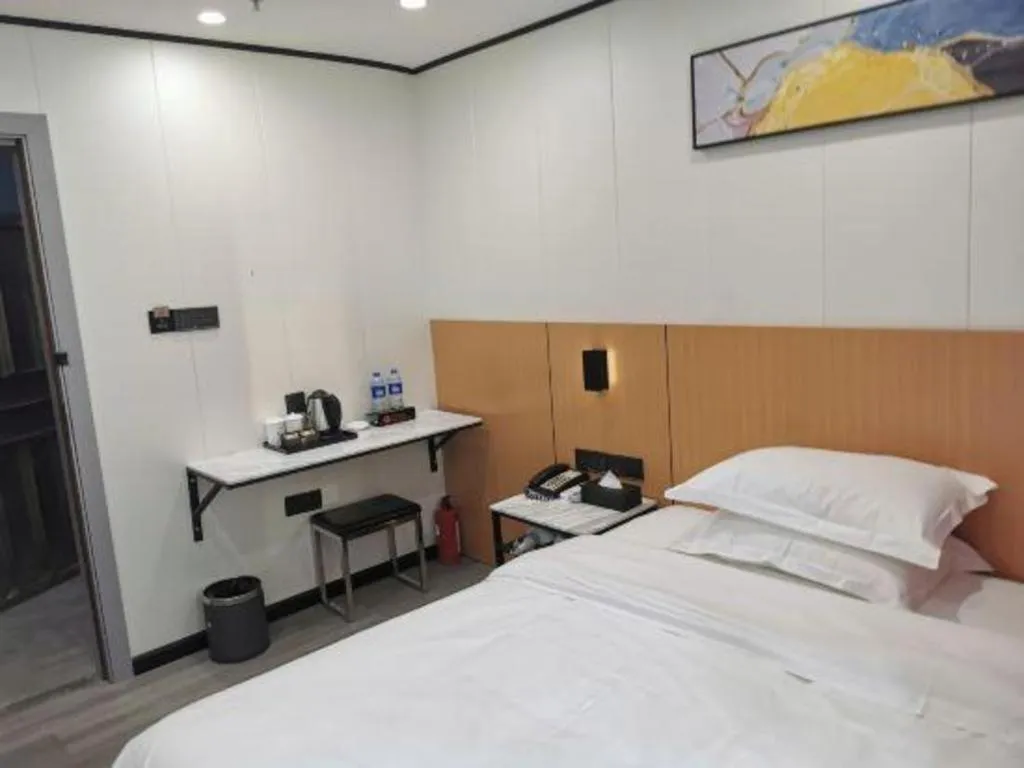 Bed in Xinghe Xinfeng Hotel Railway Station & Bus Station Branch