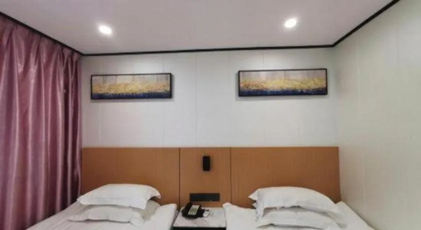 Bed in Xinghe Xinfeng Hotel Railway Station & Bus Station Branch