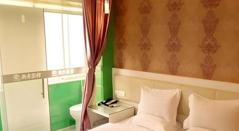 Bed in Xinghe Xinfeng Hotel Railway Station & Bus Station Branch