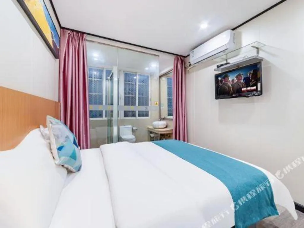 Bed in Xinghe Xinfeng Hotel Railway Station & Bus Station Branch