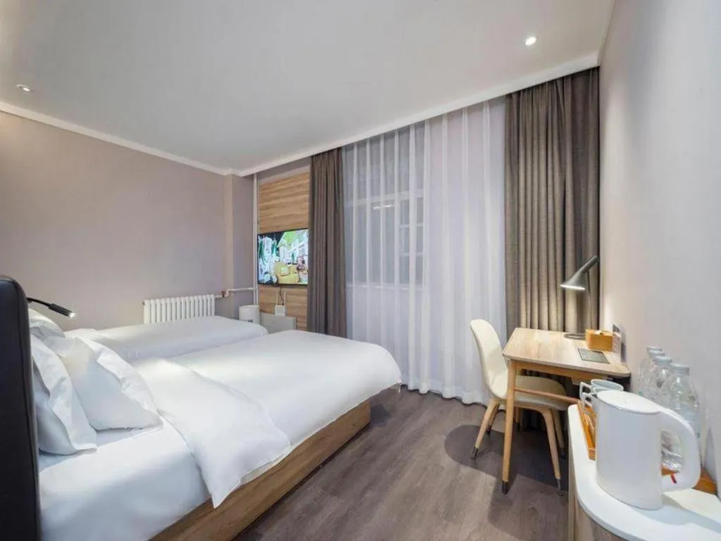 Bed in Hanting Premium Hotel Beijing Wudaokou East Gate of Tsinghua