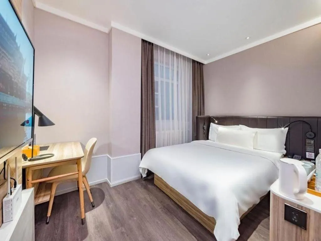 Bed in Hanting Premium Hotel Beijing Wudaokou East Gate of Tsinghua