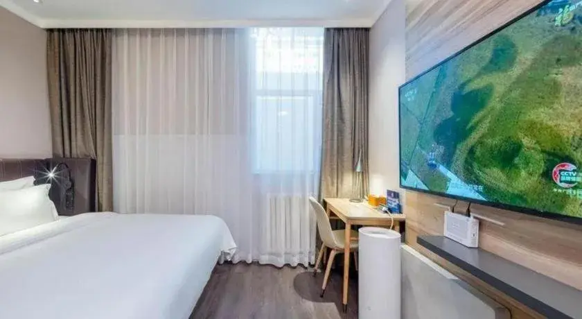 Bed in Hanting Premium Hotel Beijing Wudaokou East Gate of Tsinghua Bed in Hanting Premium Hotel Beijing Wudaokou East Gate of Tsinghua