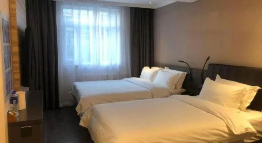 Bed in Hanting Premium Hotel Beijing Wudaokou East Gate of Tsinghua