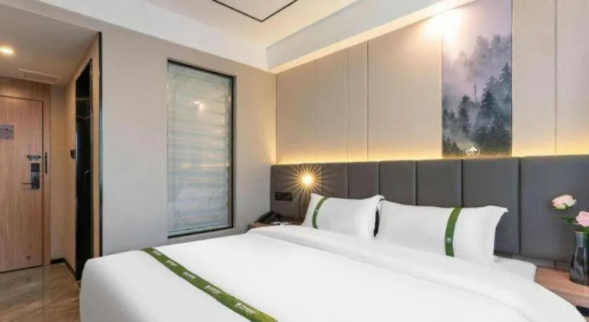 Bed in GreenTree Inn Jinan Quancheng Hotel