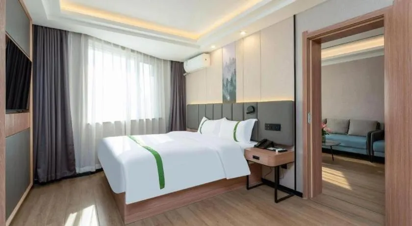 Bed in GreenTree Inn Jinan Quancheng Hotel