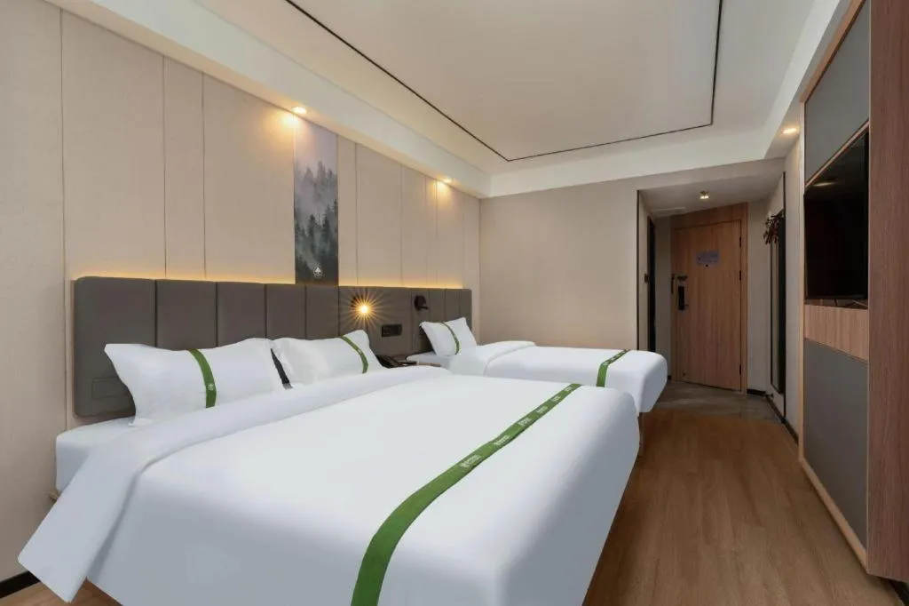 Bed in GreenTree Inn Jinan Quancheng Hotel