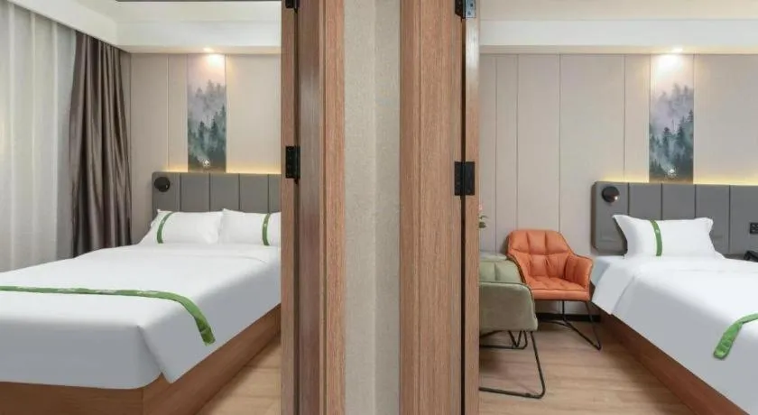 Bed in GreenTree Inn Jinan Quancheng Hotel