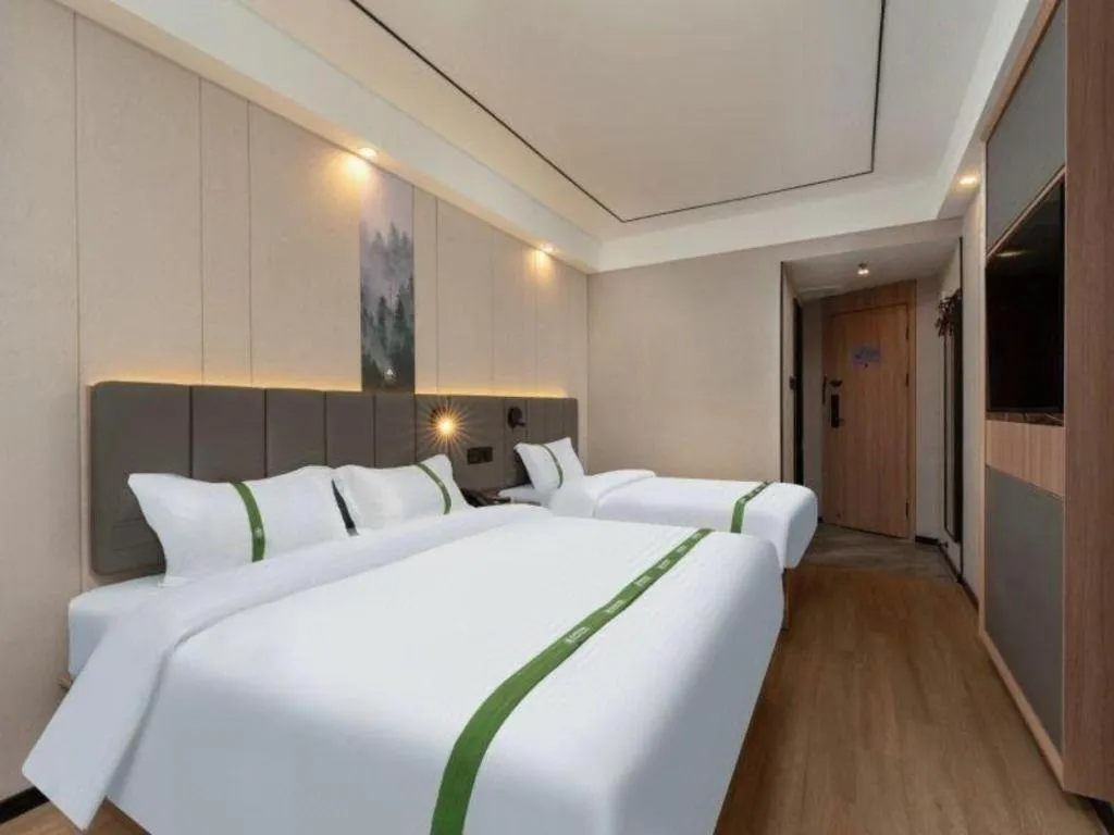 Bed in GreenTree Inn Jinan Quancheng Hotel