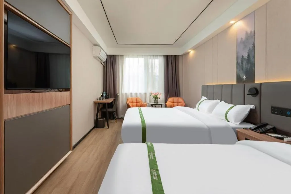 Bed in GreenTree Inn Jinan Quancheng Hotel