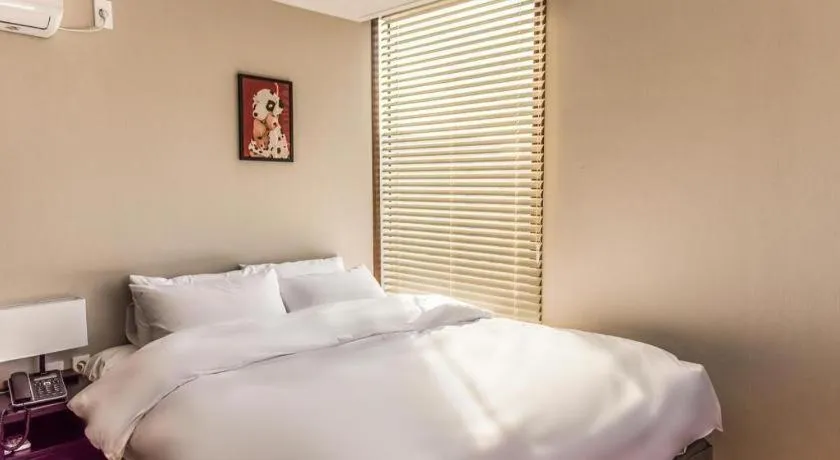 Bed in Check Inn Hotel