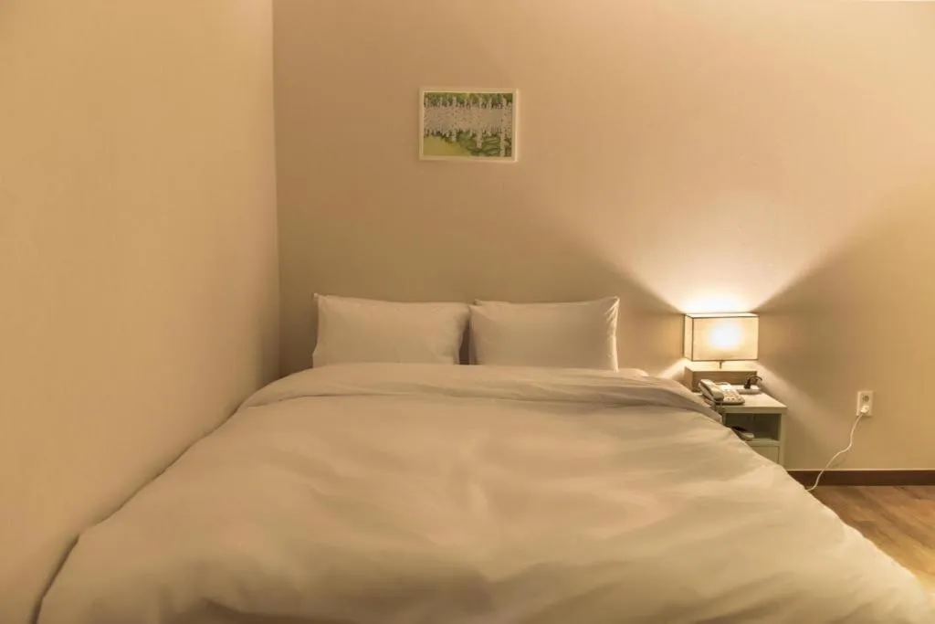 Bed in Check Inn Hotel