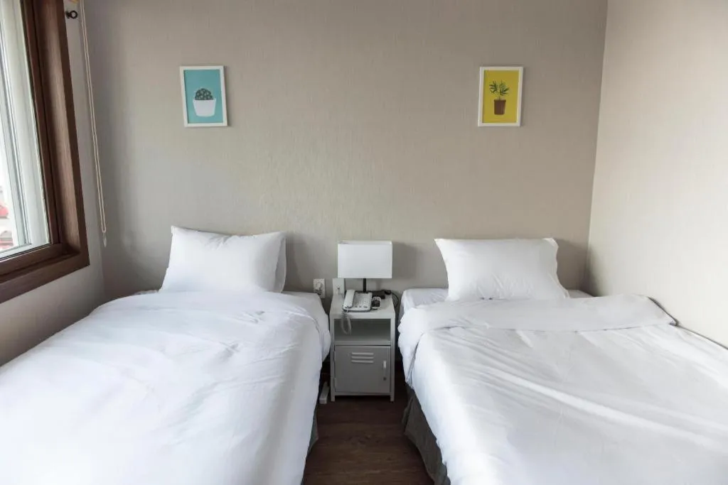 Bed in Check Inn Hotel