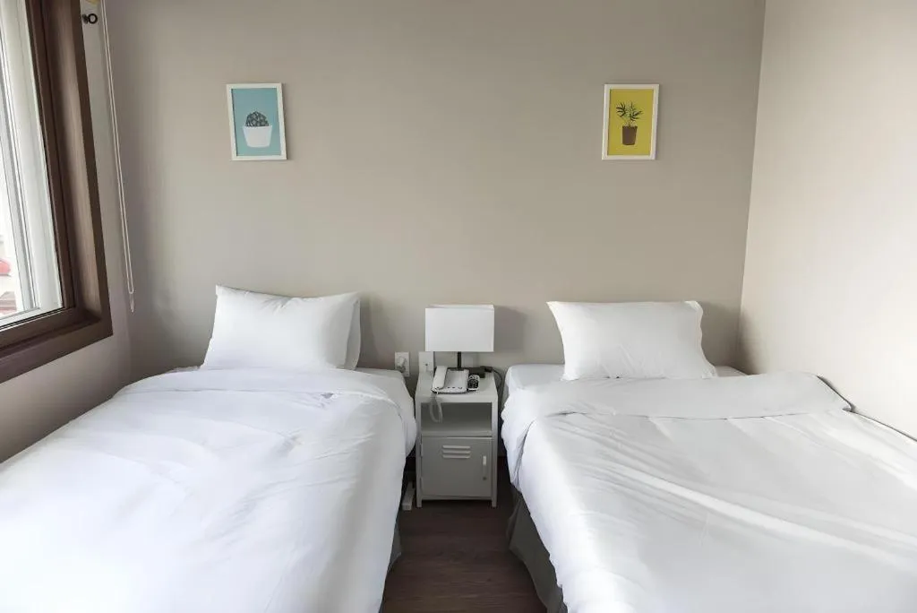 Bed in Check Inn Hotel