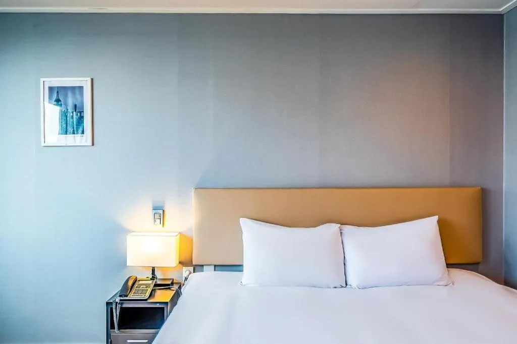 Bed in Check Inn Hotel