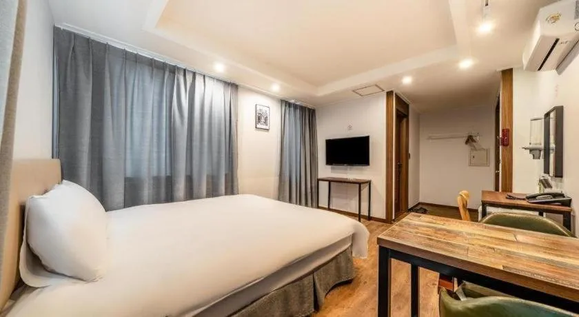 Bed in Check Inn Hotel