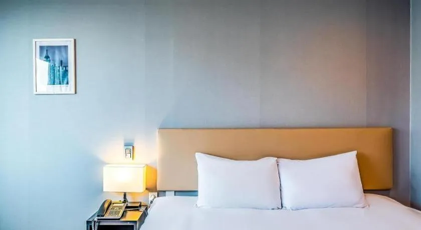 Bed in Check Inn Hotel