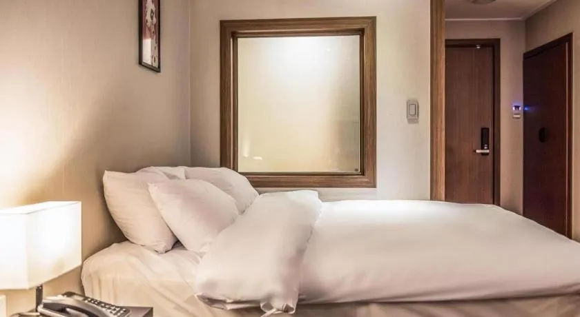 Bed in Check Inn Hotel