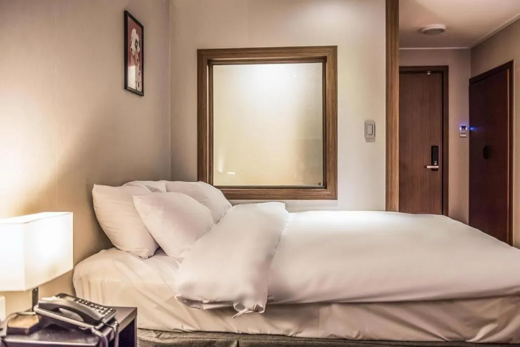 Bed in Check Inn Hotel