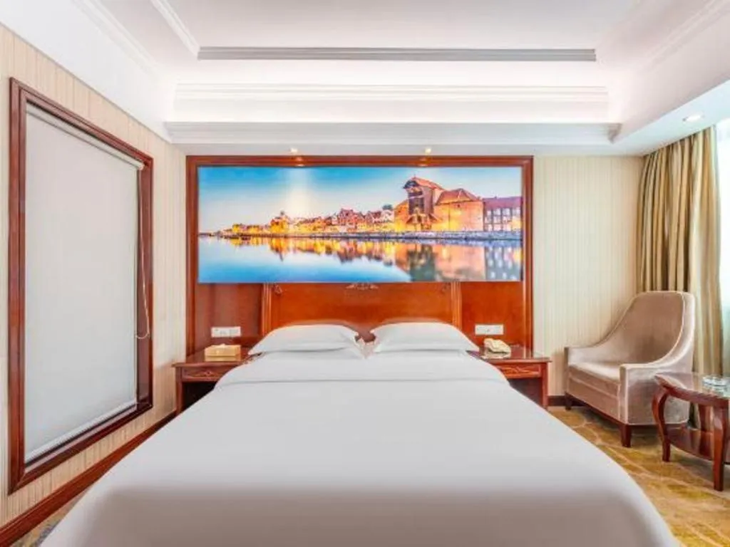 Bed in Vienna International Hotel Guangzhou Tianhe Olympic Stadium Dongpu