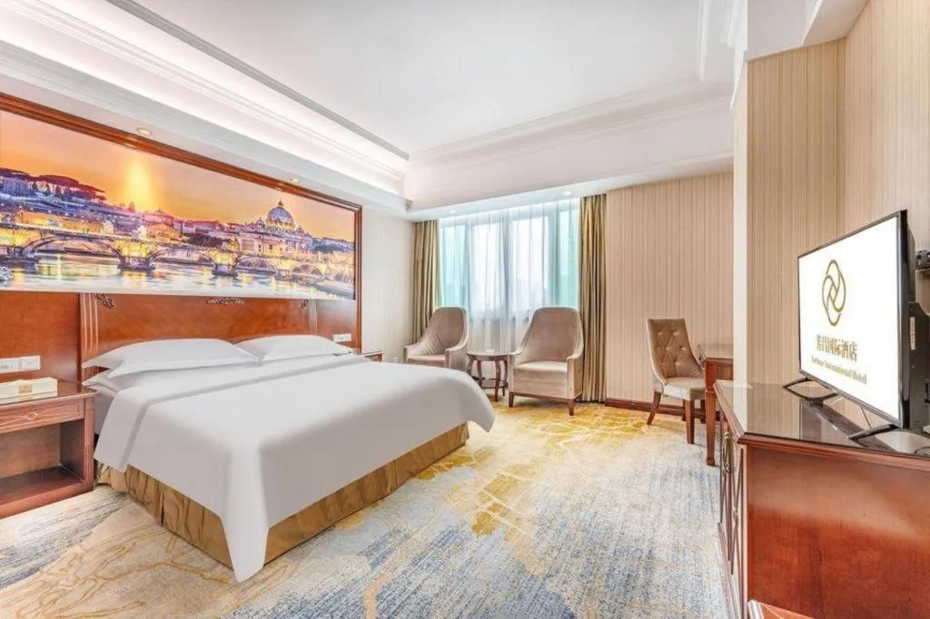 Bed in Vienna International Hotel Guangzhou Tianhe Olympic Stadium Dongpu