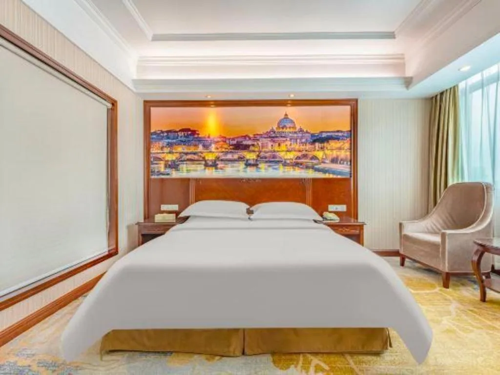 Bed in Vienna International Hotel Guangzhou Tianhe Olympic Stadium Dongpu