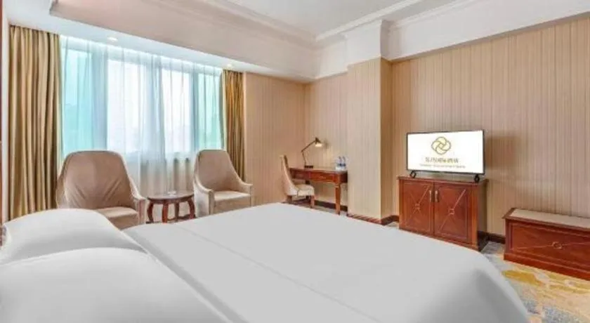 Bed in Vienna International Hotel Guangzhou Tianhe Olympic Stadium Dongpu
