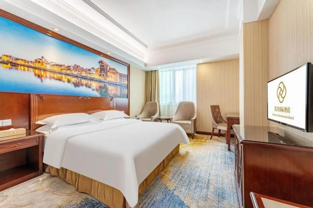 Bed in Vienna International Hotel Guangzhou Tianhe Olympic Stadium Dongpu