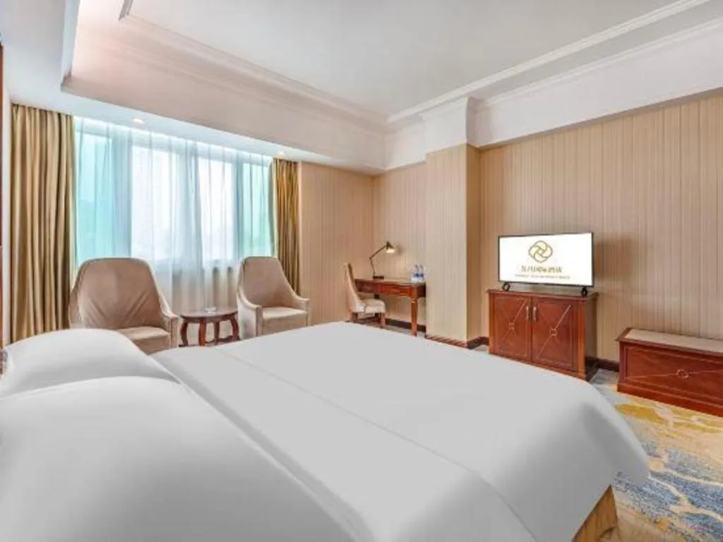 Bed in Vienna International Hotel Guangzhou Tianhe Olympic Stadium Dongpu