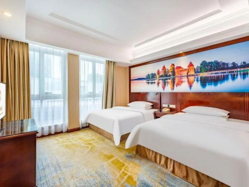 Bed in Vienna International Hotel Guangzhou Tianhe Olympic Stadium Dongpu
