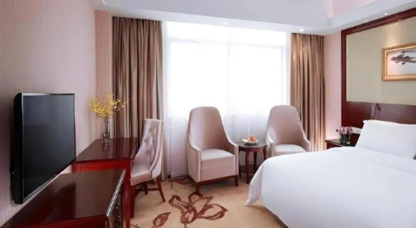 Bed in Vienna International Hotel Guangzhou Tianhe Olympic Stadium Dongpu