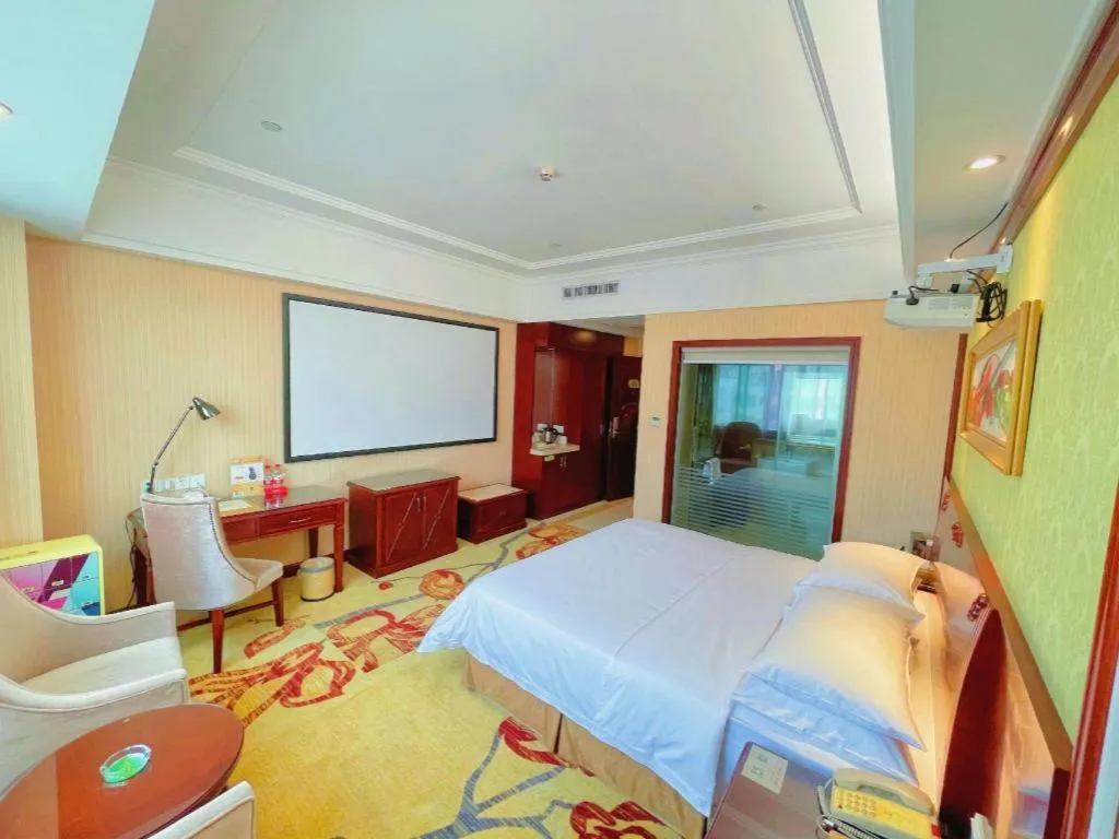 Bed in Vienna International Hotel Guangzhou Tianhe Olympic Stadium Dongpu