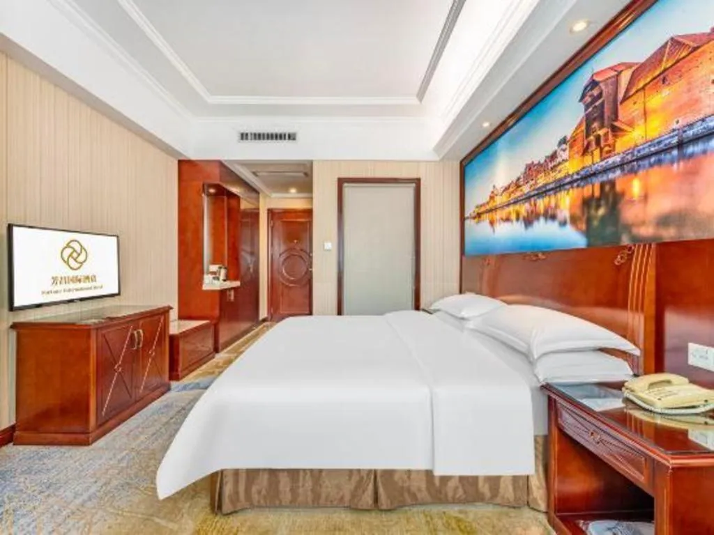 Bed in Vienna International Hotel Guangzhou Tianhe Olympic Stadium Dongpu