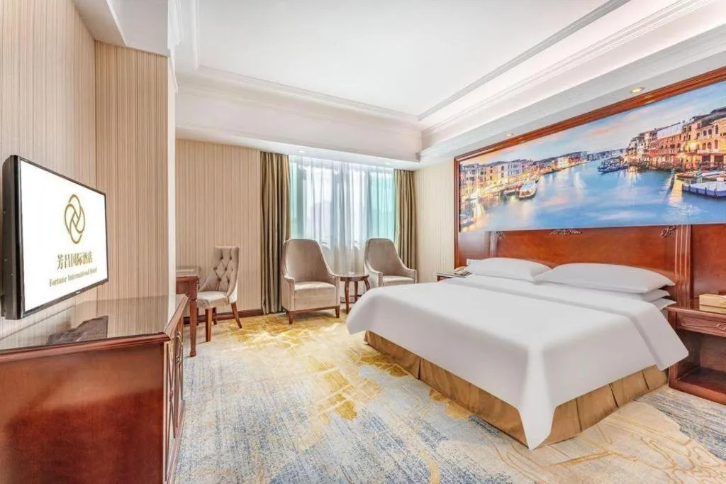 Bed in Vienna International Hotel Guangzhou Tianhe Olympic Stadium Dongpu
