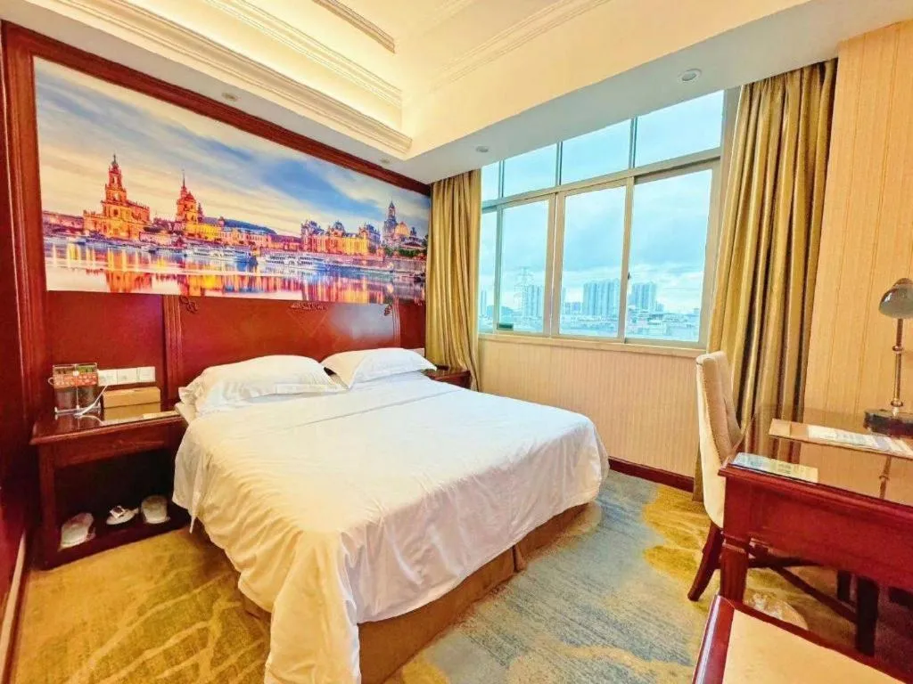 Bed in Vienna International Hotel Guangzhou Tianhe Olympic Stadium Dongpu