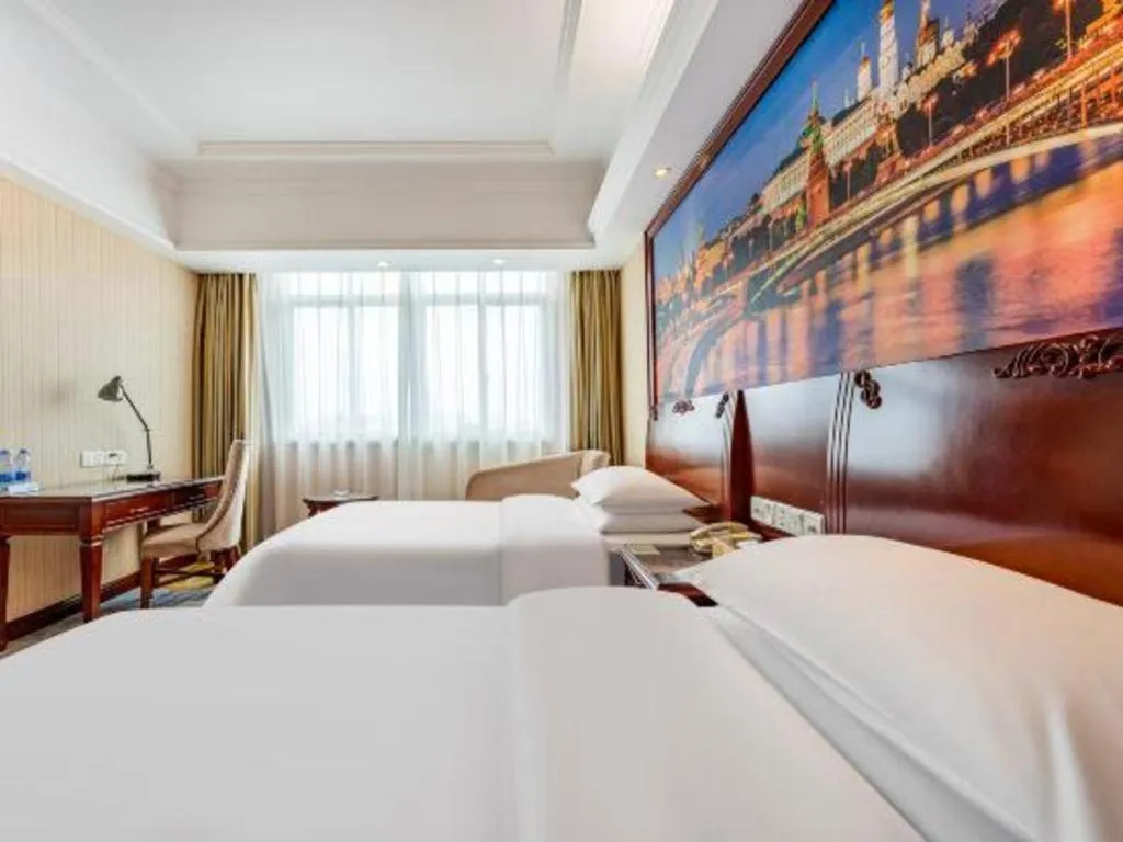 Bed in Vienna International Hotel Guangzhou Tianhe Olympic Stadium Dongpu