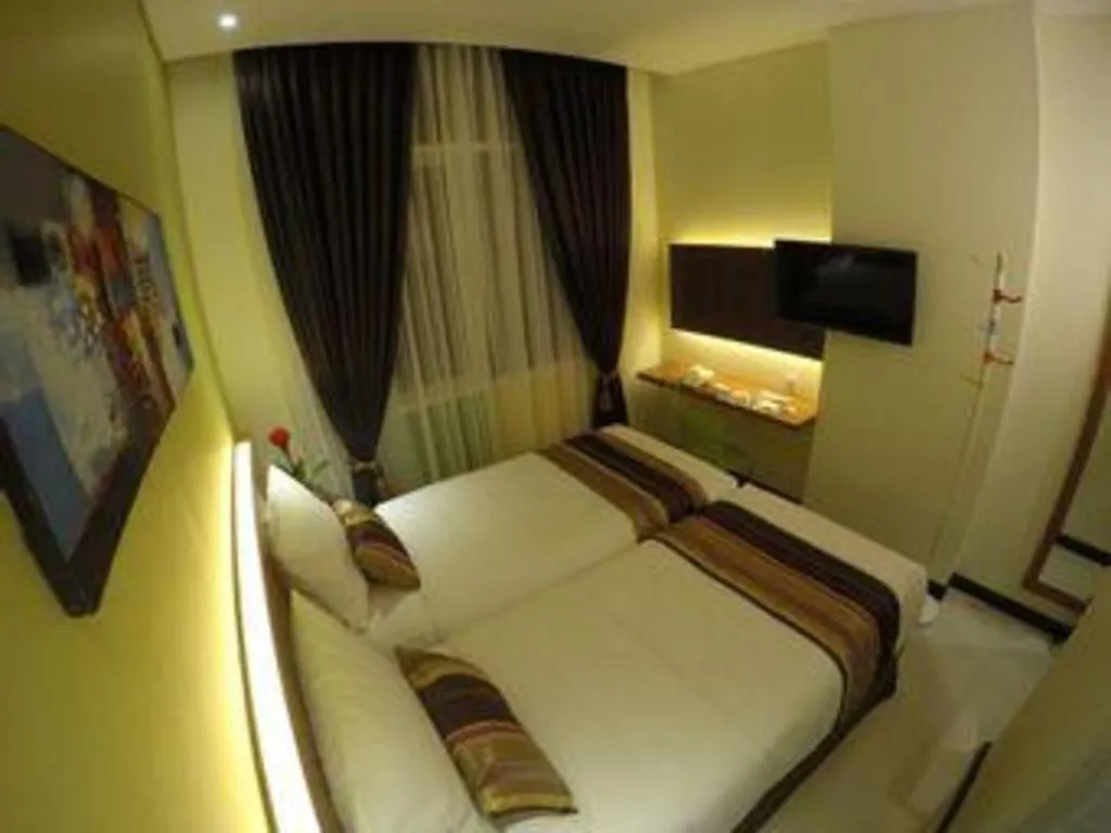 Bed in Biz Boulevard Hotel