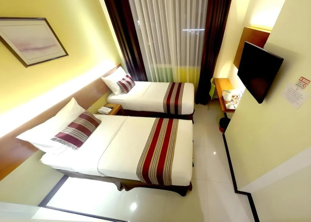 Bed in Biz Boulevard Hotel