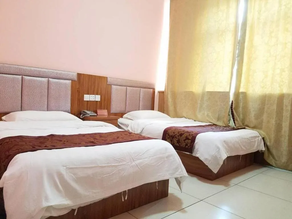 Bed in 169 Business Hotel