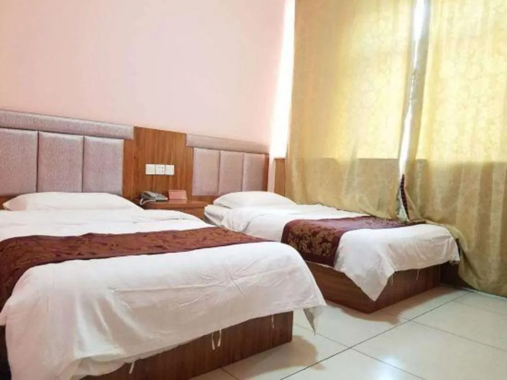 Bed in 169 Business Hotel