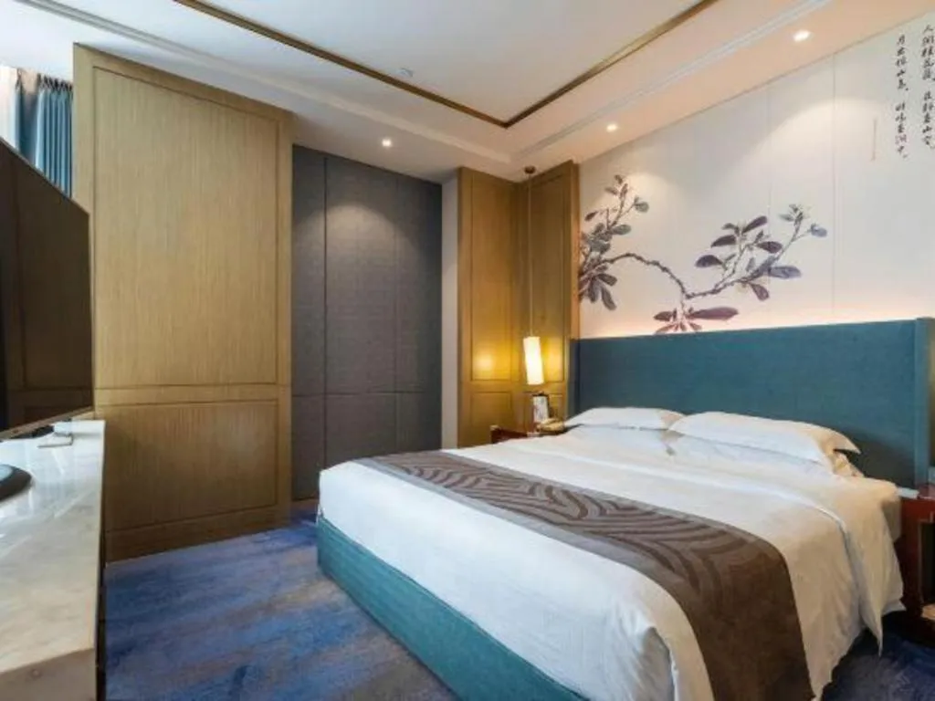 Bed in Bliss International Hotel Weihai