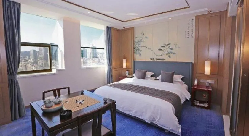 Bed in Bliss International Hotel Weihai